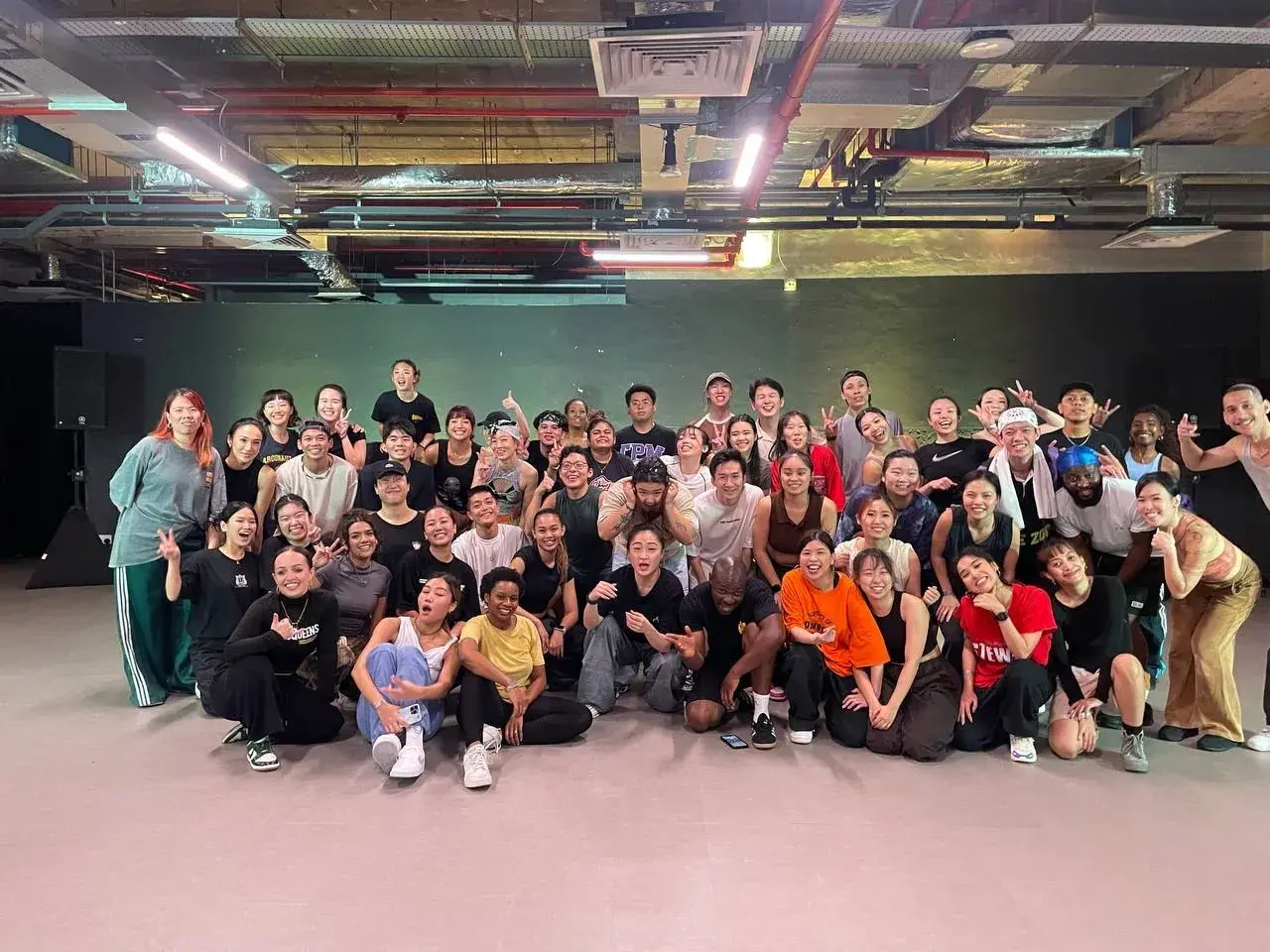 The whole cohort gathered for a group photo after a class