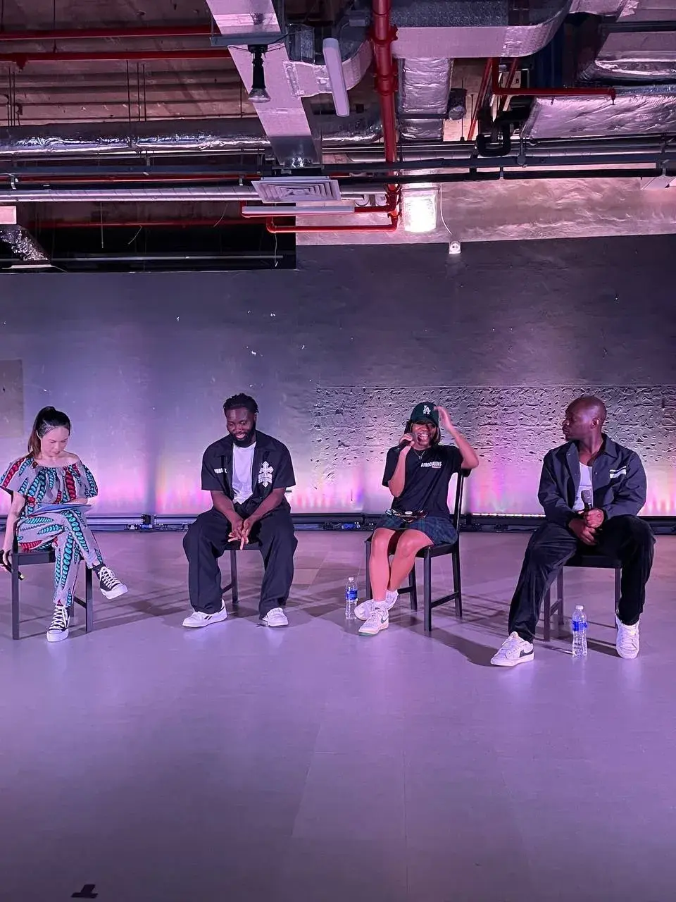 Instructors seated on stage during the Showcase dialogue segment