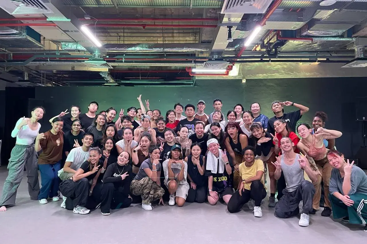 The full ACE 2025 cohort gathered for a group photograph in the studio after a class.
