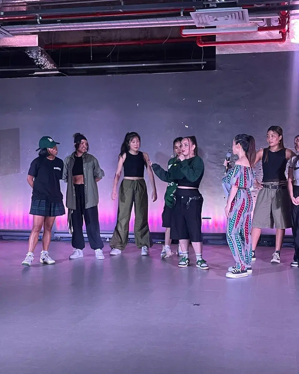 Performers lined up across the stage at the ACE 2025 showcase.